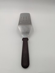 Update International 10″ x 3″ Perforated Turner w/ Plastic Handle