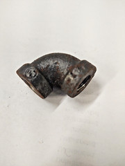 Fitting, elbow 90 degree, 1/8 FNPT x 1/8 FNPT, cast iron 125lb