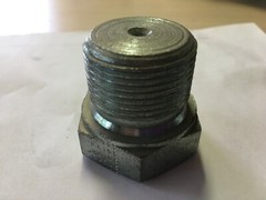 PLUG,HEADER,SA105,COOLER,TYPE:SHOULDER,DIAMETER:1-1/4 IN,W/UNDER THE HEAD: 1IN