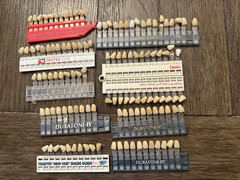 Assorted shade guides from multiple brands