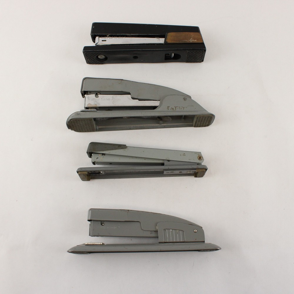 Four Vintage Swingline Staplers Gunmetal Grey (3) & one w/ Woodgrain Pattern