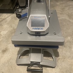Hotronix fusion-IQ heat press machine, color gray, size is a 16in x 20in