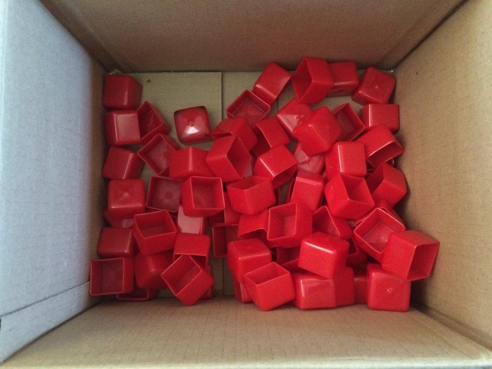 Red Vinyl PVC Square Cap covers the end of a 1-1/4″ Square Tube