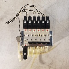 Koganei 040M6A-64W Manifold Block with (7) A040-4E1-37W Solenoid Valves 0.3MPa