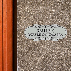 Designer Smile You’re on Camera Sign – Easy Installation | Durable Wall or Do…