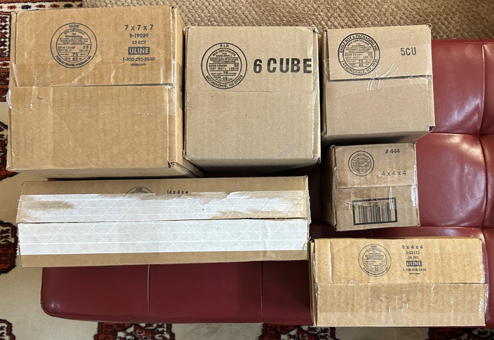 Fourteen (14) small cardboard mailing boxes, Various sizes, Used