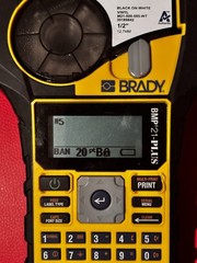Brady BMP21-PLUS Handheld Label Maker/Printer w/ M21-500-595-WT 1/2 in
