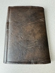 Handcrafted vintage-style brown leather journal with a bronze metal clasp.