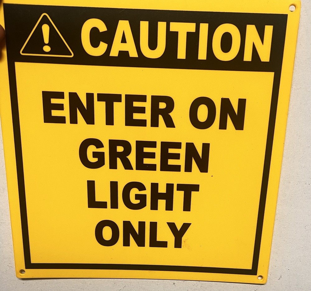 CAUTION Enter On Green Light Only Safety Sign Yellow Black Wall Mount