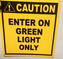 CAUTION Enter On Green Light Only Safety Sign Yellow Black Wall Mount
