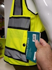 Safety green surveyor vest with tablet pocket.