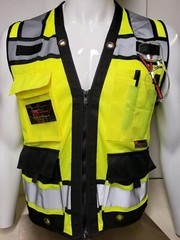 Safety green surveyor vest with tablet pocket.