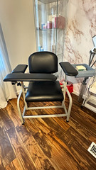 Midmark Black Upholstered Exam Table with Armrests, Family Medicine