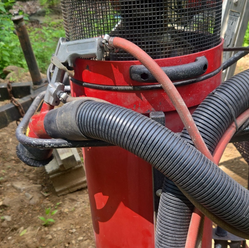 Red Wheeled Industrial Canister Vacuum Unit with Hose Attachment Included
