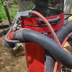 Red Wheeled Industrial Canister Vacuum Unit with Hose Attachment Included