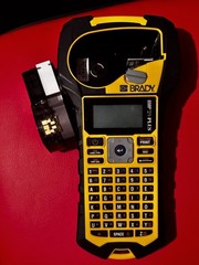 Brady BMP21-PLUS Handheld Label Maker/Printer w/ M21-500-595-WT 1/2 in