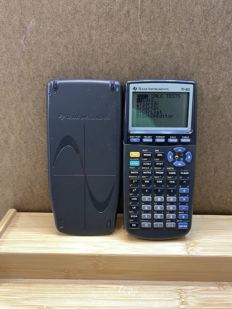 1990’s Texas Instruments TI-83 Graphing Calculator & Case W/new batteries