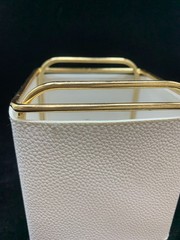 GOLD AND WHITE FAUX LEATHER DESK ORGANIZER.