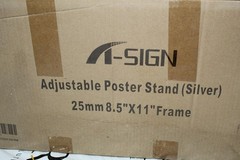 A Sign Adjustable Poster Stand Silver holds 8.5 X 11 inch frame