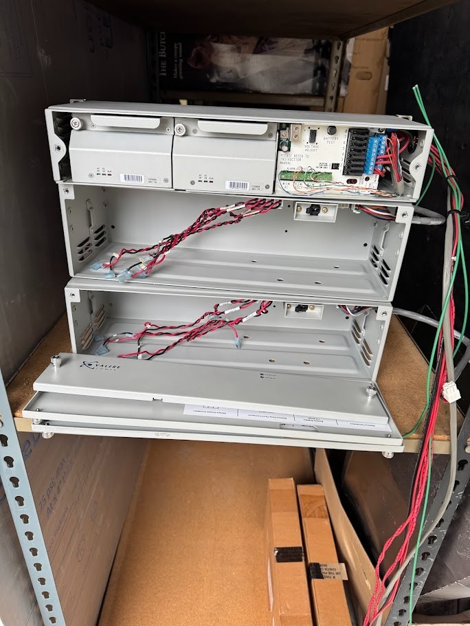 Two Eltek Valere C0350A-VC 48V power rectifiers w/chassis and two battery boxes
