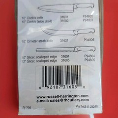 Russell International 12″ Slicer Knife Serrated High Carbon Steel White Handle