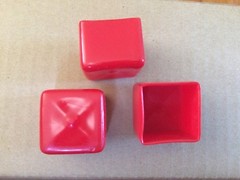 Red Vinyl PVC Square Cap covers the end of a 1-1/4″ Square Tube