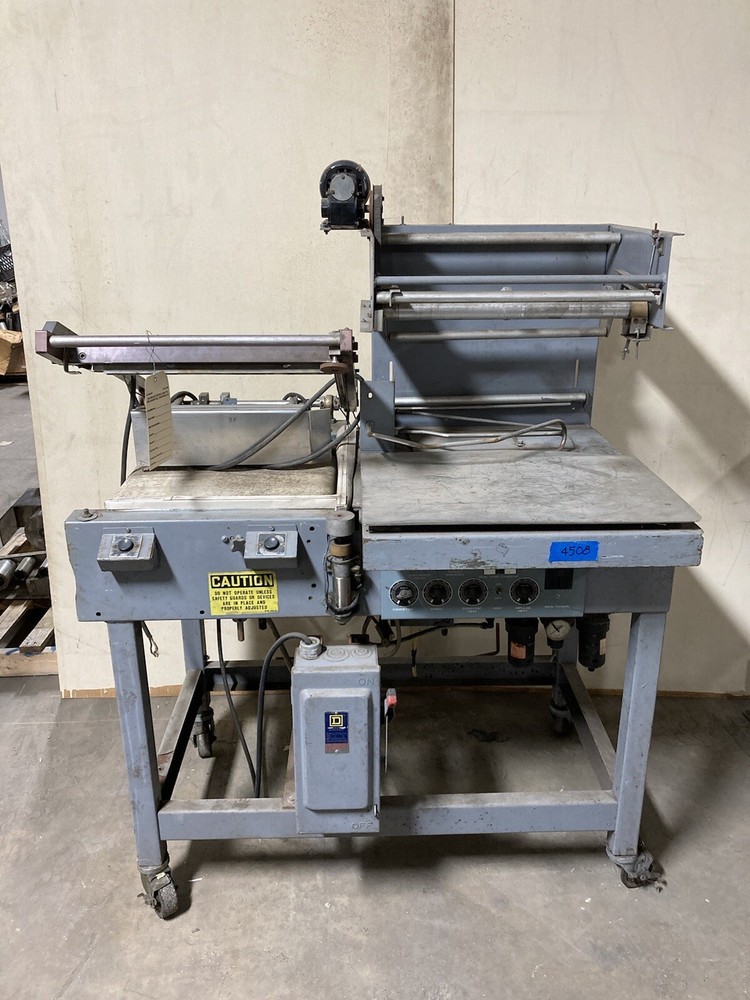 Semi automatic Shanklin S-23C L-Sealer with take away belt and power film feed