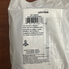 Leviton 3056-E Duplex flip lid cover for use with rubber box.