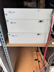Two Eltek Valere C0350A-VC 48V power rectifiers w/chassis and two battery boxes