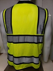 Safety green surveyor vest with tablet pocket.