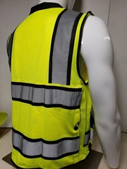 Safety green surveyor vest with tablet pocket.